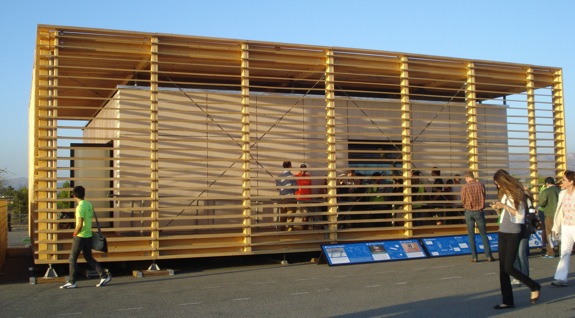 A large wooden slatted box surronds the AIR House.